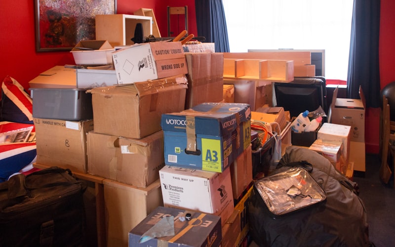 A Santa Barbara home filled with stacked moving boxes during an estate cleanout