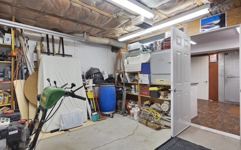 A cluttered Santa Barbara garage packed with tools and shelves, ready for a full cleanout