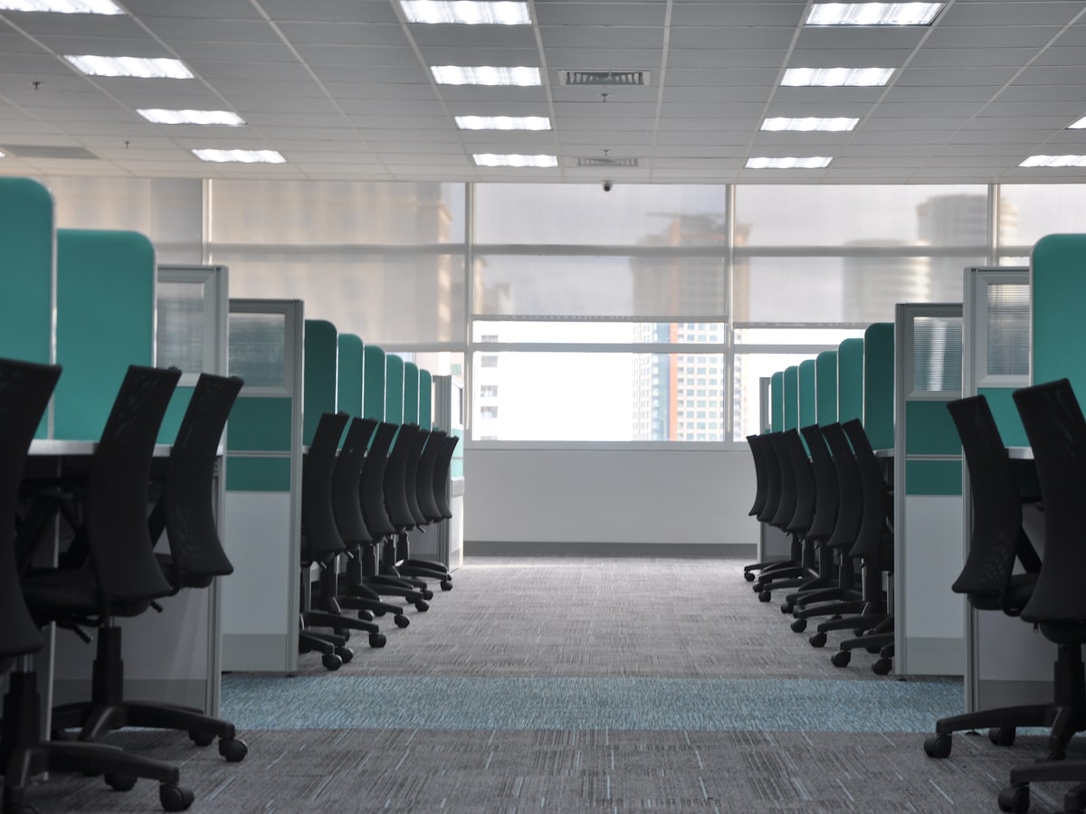 Empty office cubicles and chairs cleared during a commercial cleanout